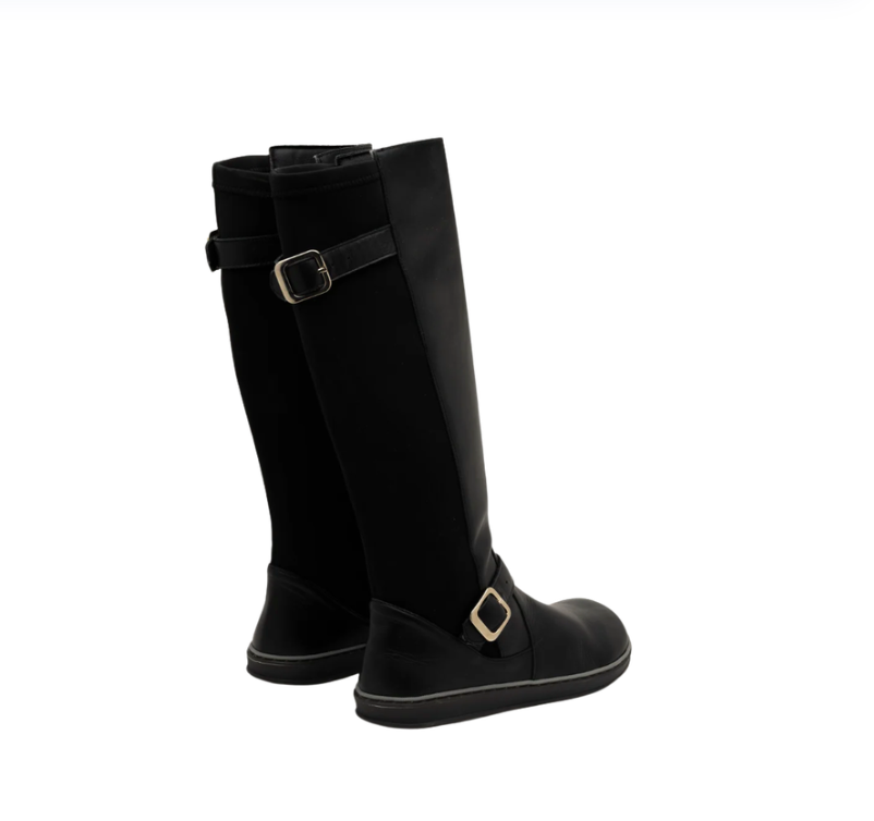 Pair of black tall boots with metal buckles, viewed from behind.