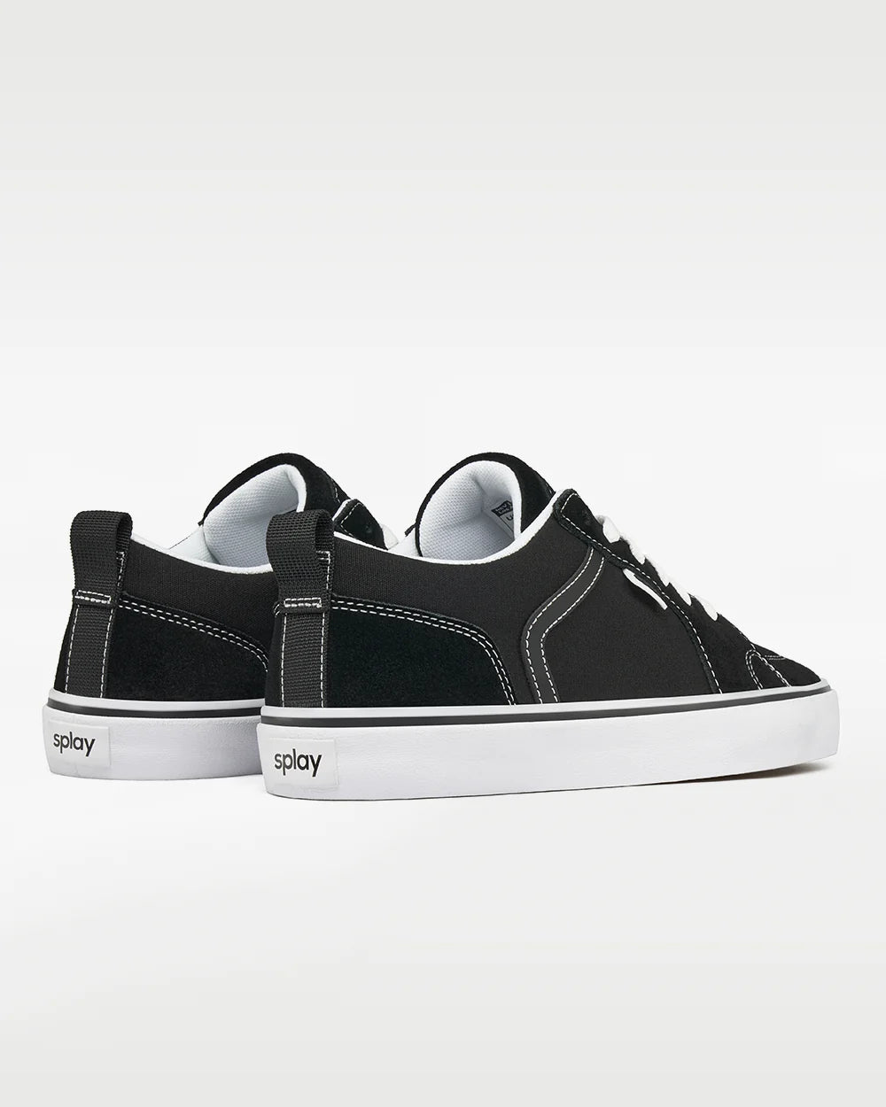Pair of black SPLAY REV LTS sneakers viewed from behind and the side, with heel counters and white soles.