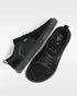 Low-profile black sneakers viewed from above, with laces and perforated toes.